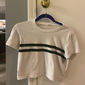cropped white t shirt with two green stripes